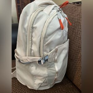 The North Face Cream Backpack with Orange Zipper Pulls